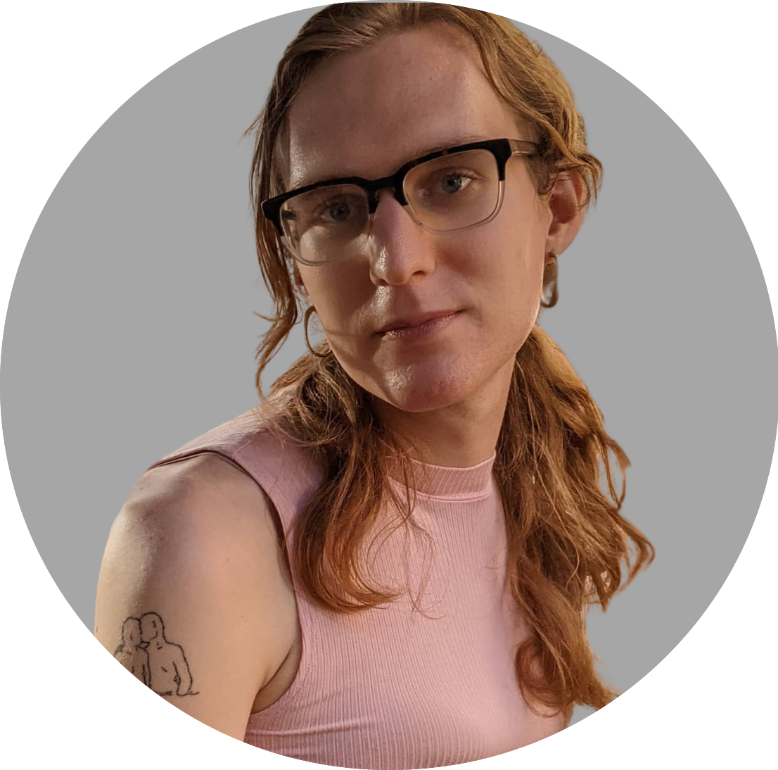 woman with blond hair and glasses looks over right shoulder